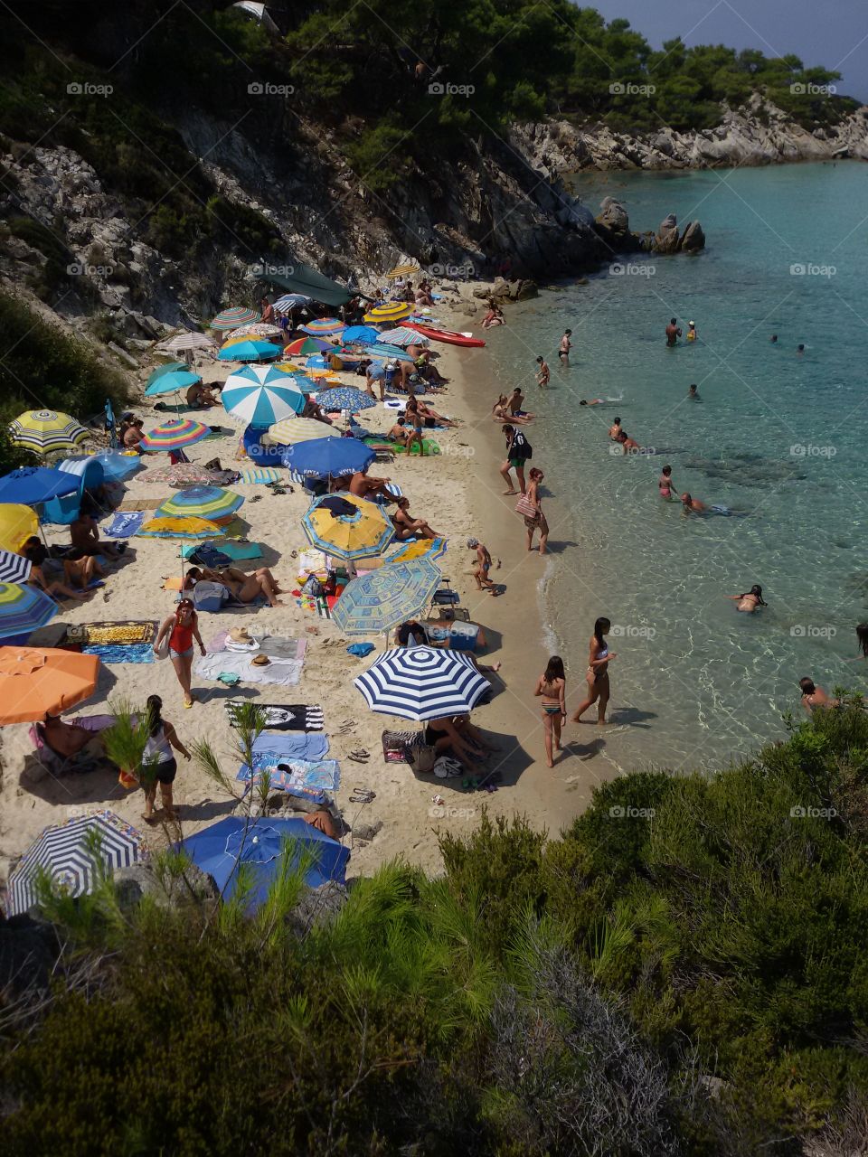 Sand beach full of people. Orange beach, Sithonia, Greece