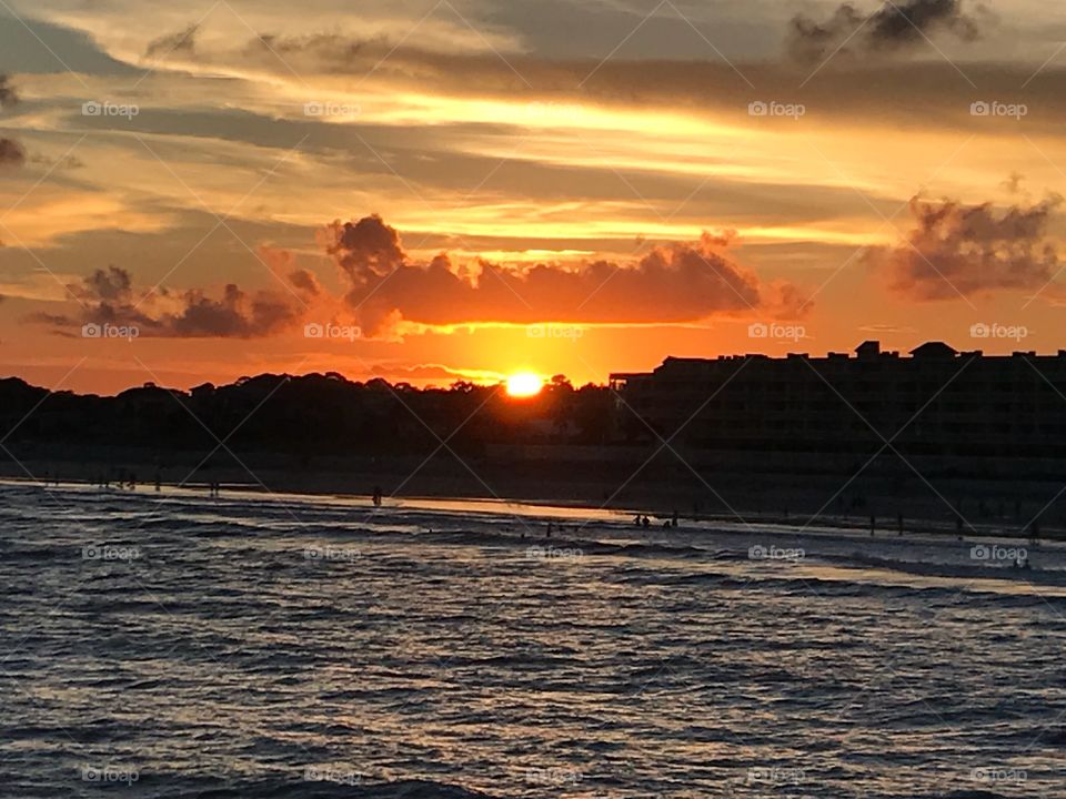 Watching the sunset from the beach pier