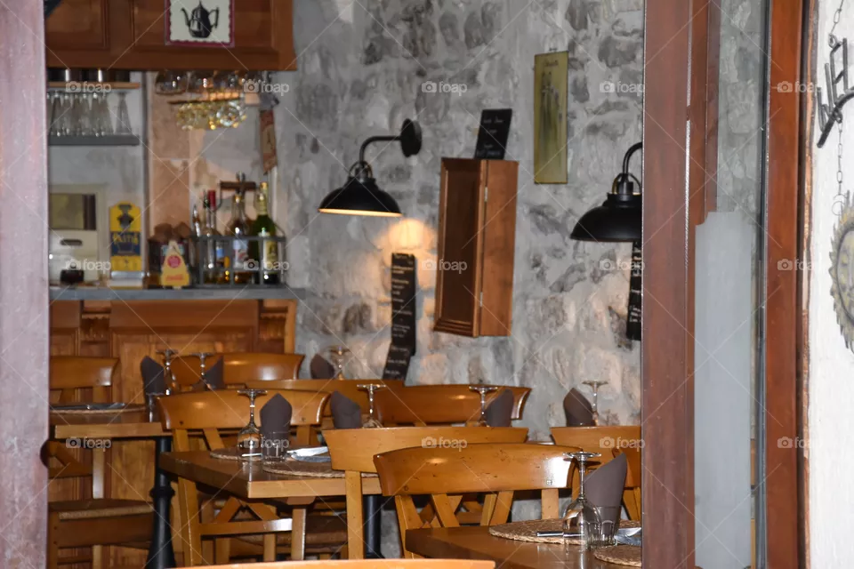 French restaurant with wooden tables and chairs 