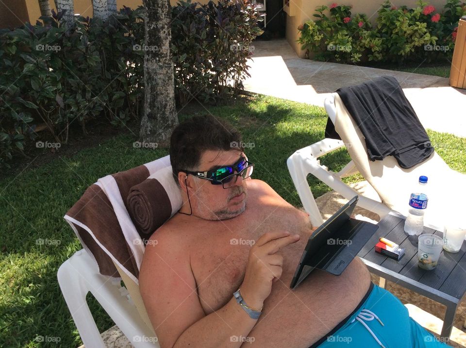 Man relaxing with laptop 