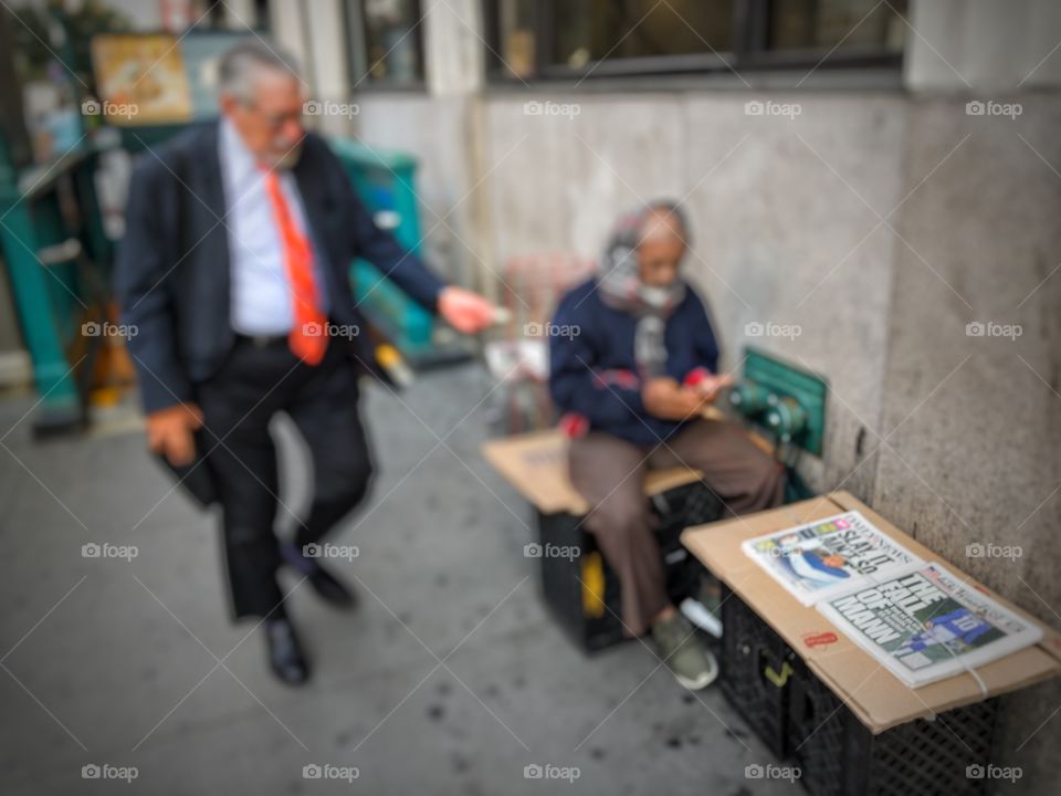 Man buying newspaper