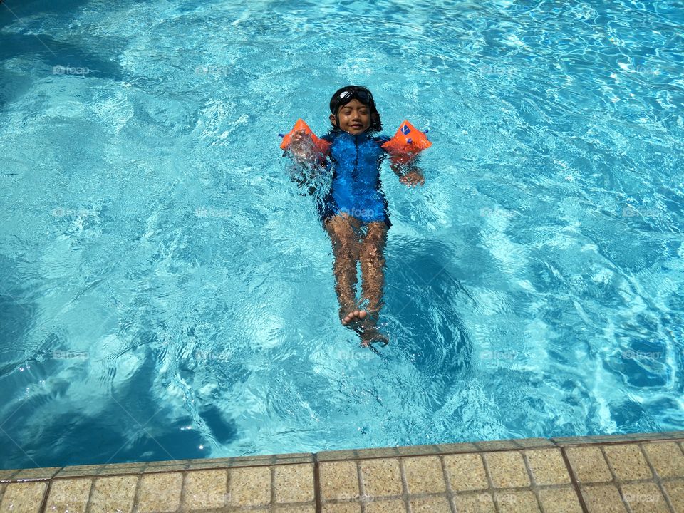 have fun child with swimming pool
