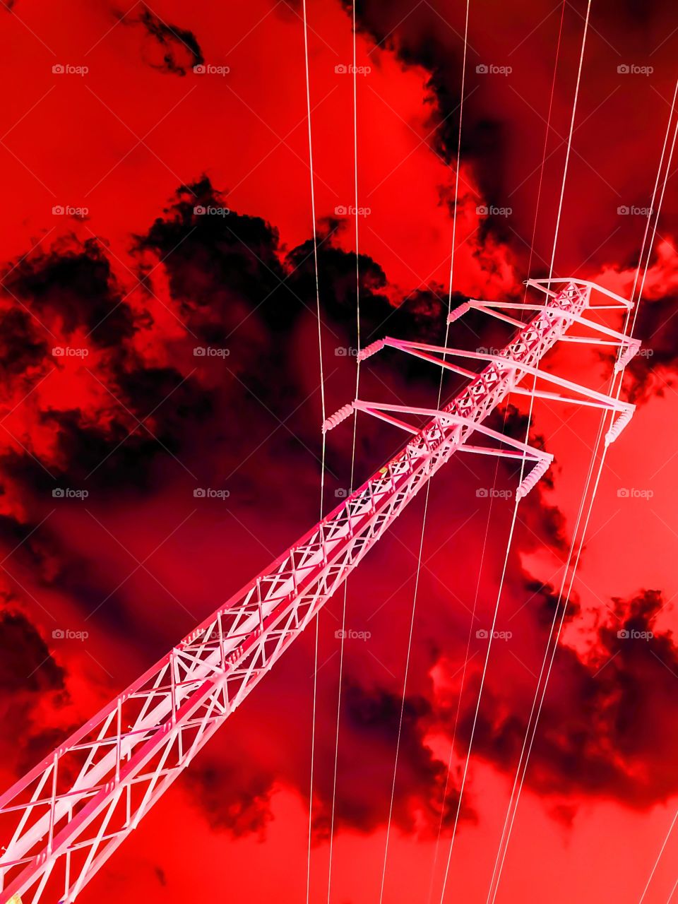 Red Power Tower. Negative power line tower image filtered in red.