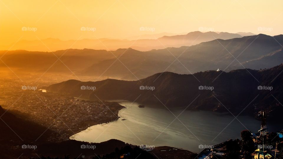 Sunrise and Phewa Lake with golden sun rays at Pokjara, Nepal