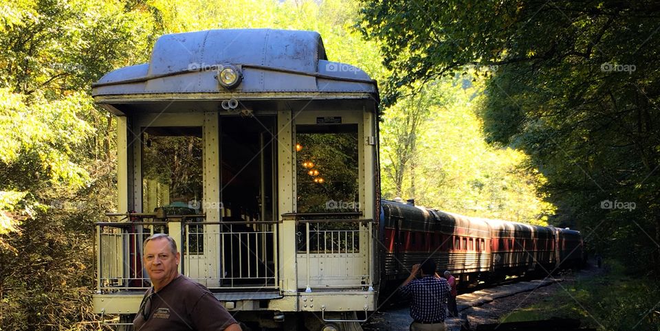 Parlor dining car on train ride through the mountains. 