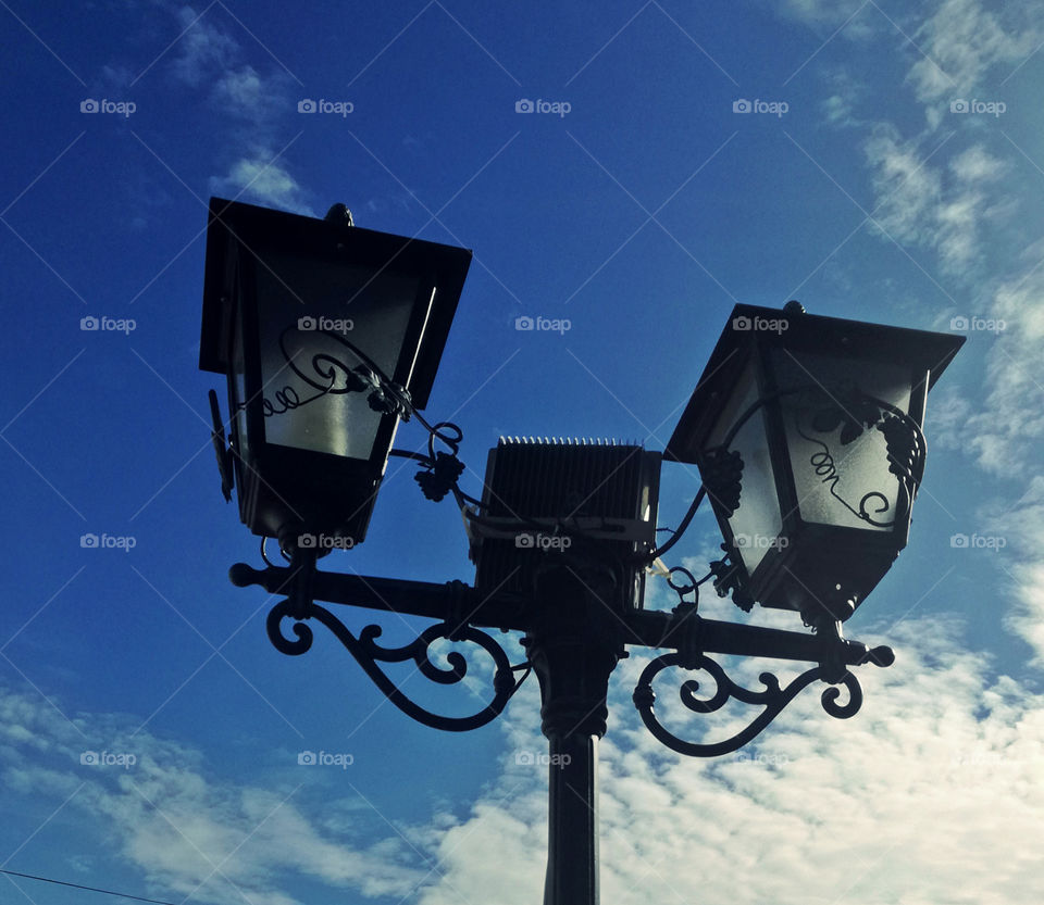 street lamp and blue sky with clouds