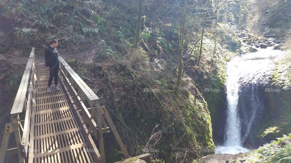 waterfall. A friend from Sweden hiking in Oregon