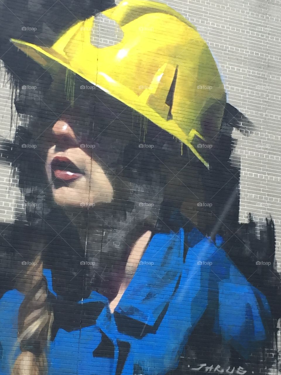 A peace of art on a building in Sudbury Ontario,Depicting women in hardhat and coveralls whether it be my mining or Construction this piece of art clearly shows women are not limited in careers