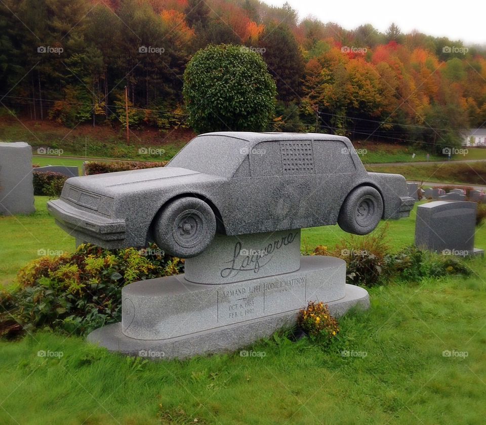 Race car memorial. Yup, it's a race car headstone.  Crazy!
