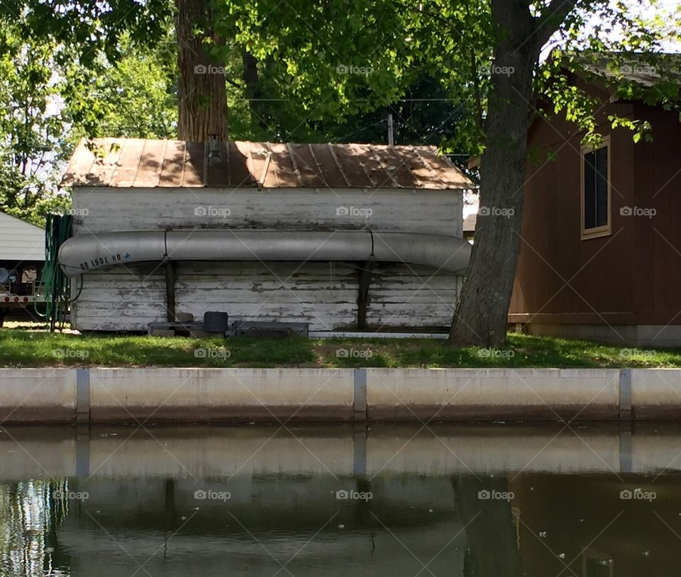 Canoe mounted on shed