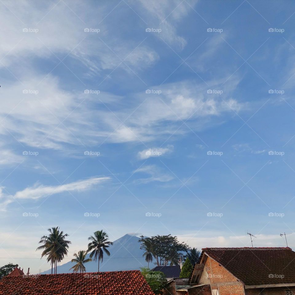 village and mountain view with blue sky
