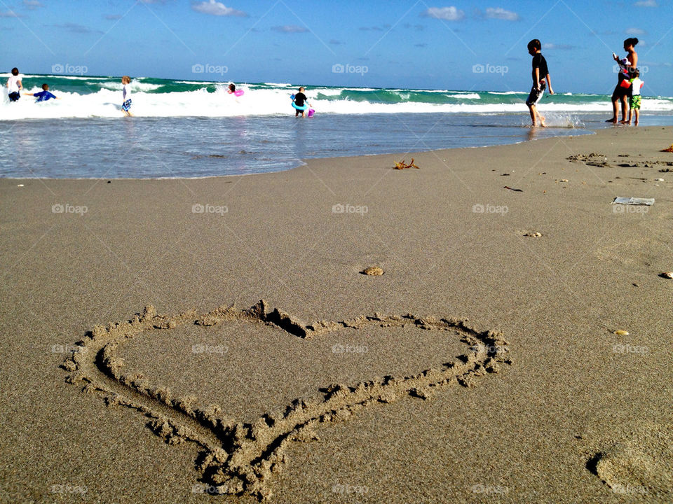 Heart drawn on sand at beach, Hollywood Beach, Florida