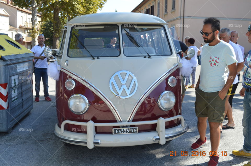 People standing near camping van