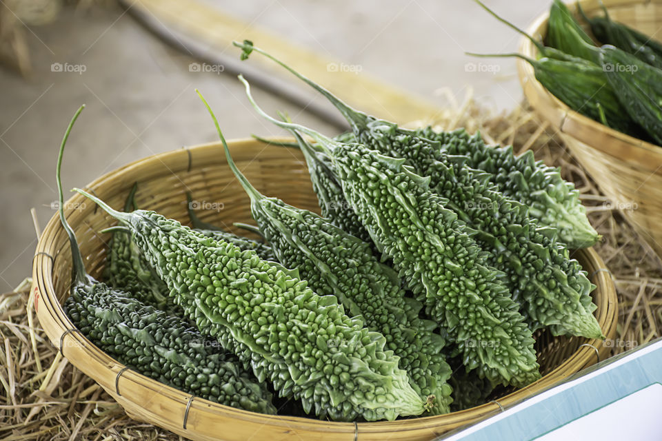 Bitter gourd fresh from the garden in bamboo baskets.