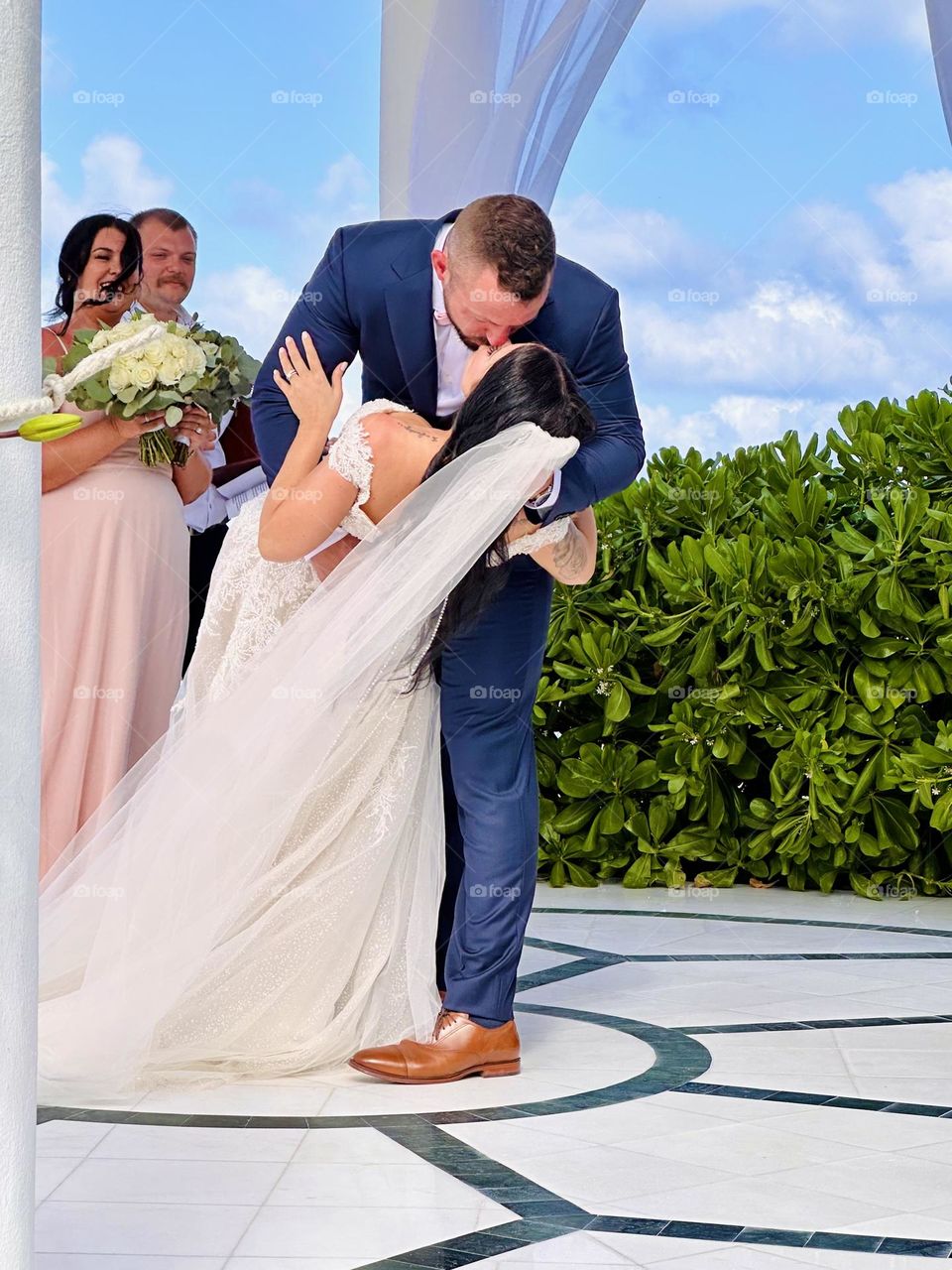 The kiss. That perfectly posed, romantic kiss between the bride and groom