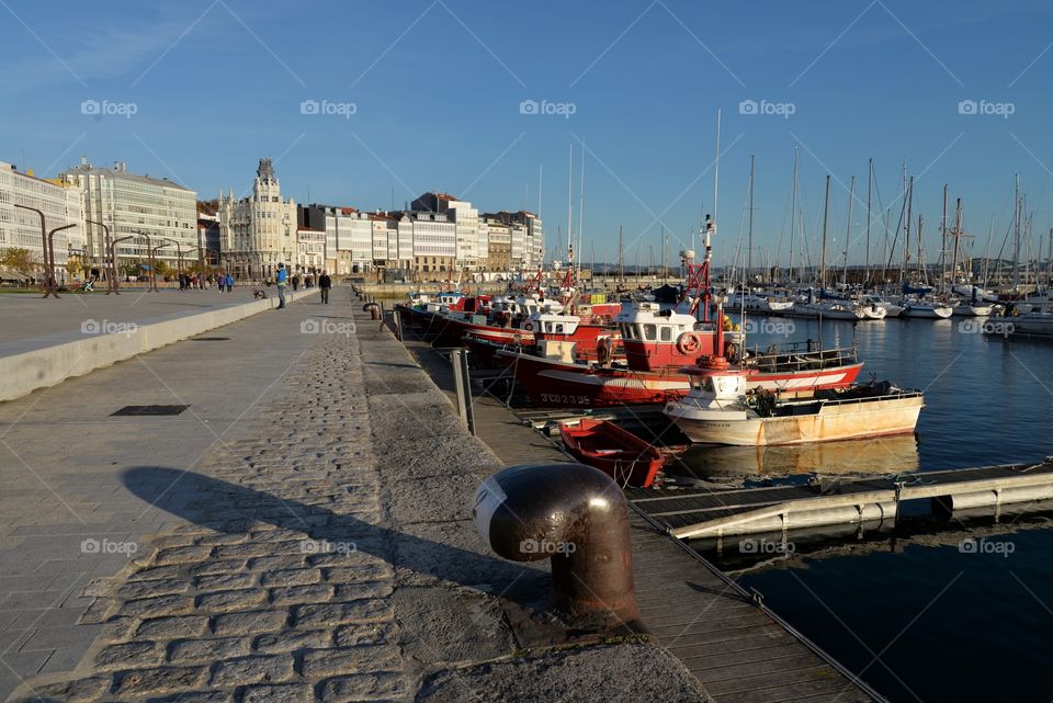 port entrance with detail of boats tied at the marina in the city of Coruña, Spain