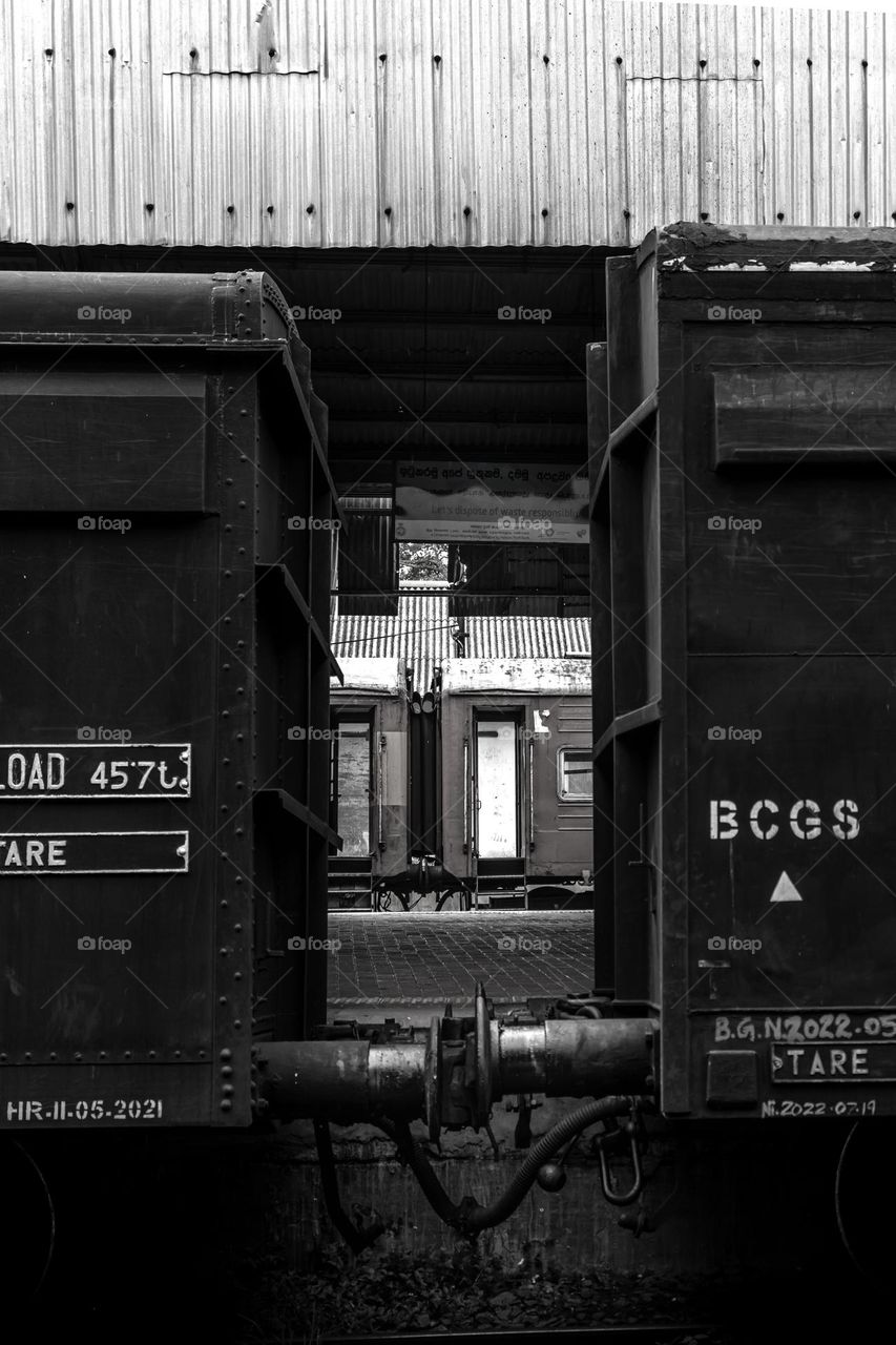 Rail carts parked at Anuradhapura railway station, Sri Lanka. Black and white bs colour.