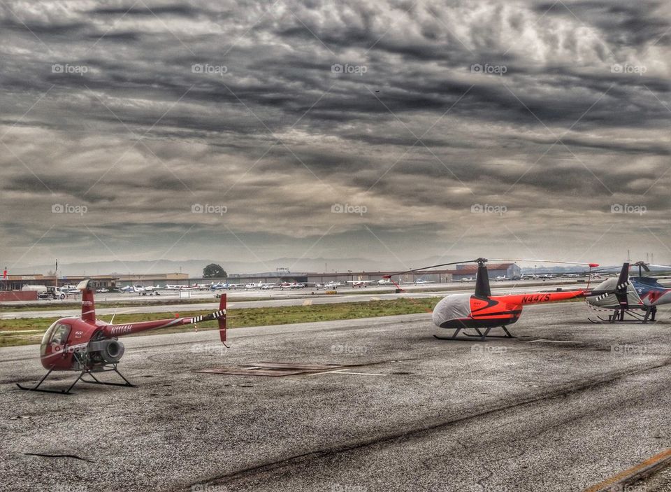 Helicopters On The Flightline. Robinson R-22 And R-44 Helicopters On The Flightline
