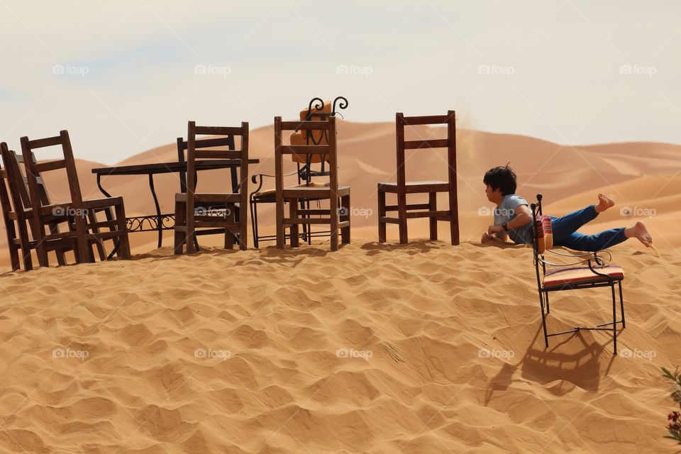 Boy playing in the Sahara 