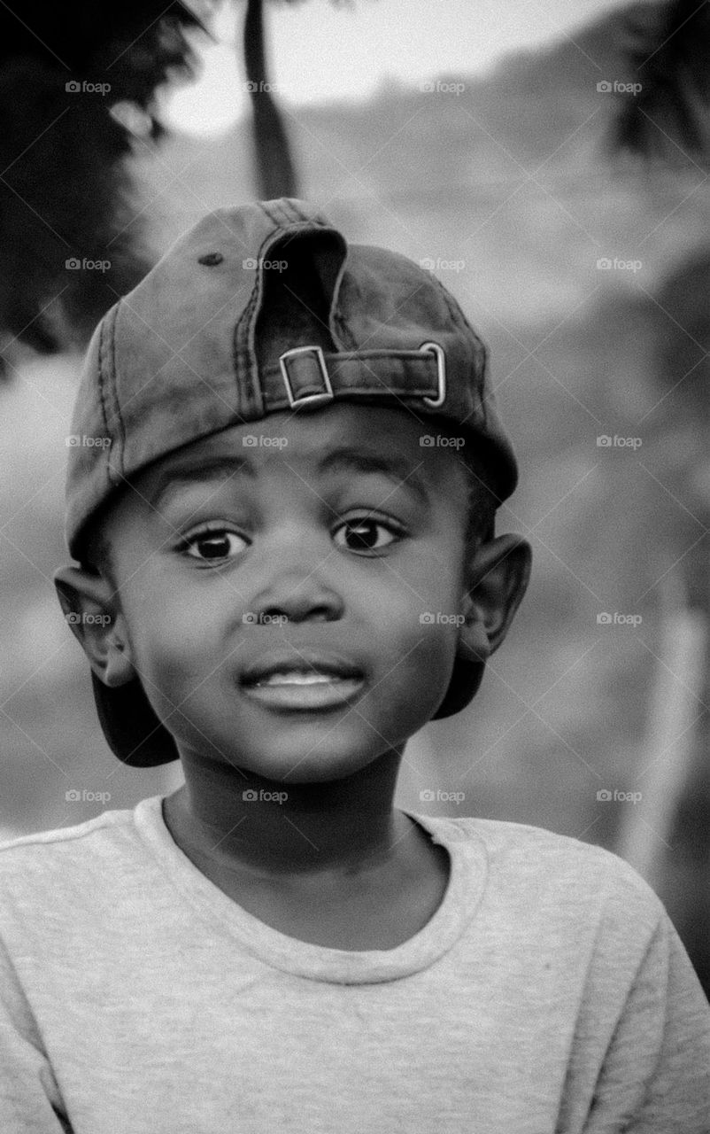 a boy in black and white showing a chilled face
