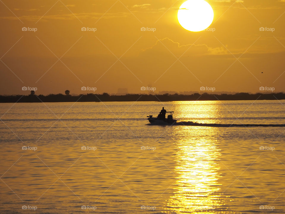 Boating at sunrise