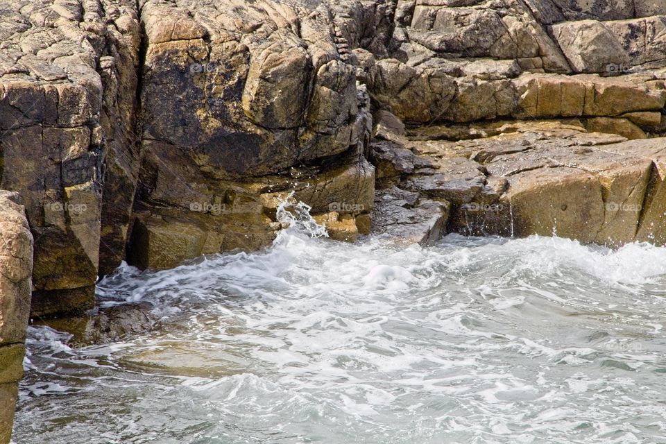 waves crashing on rocks
