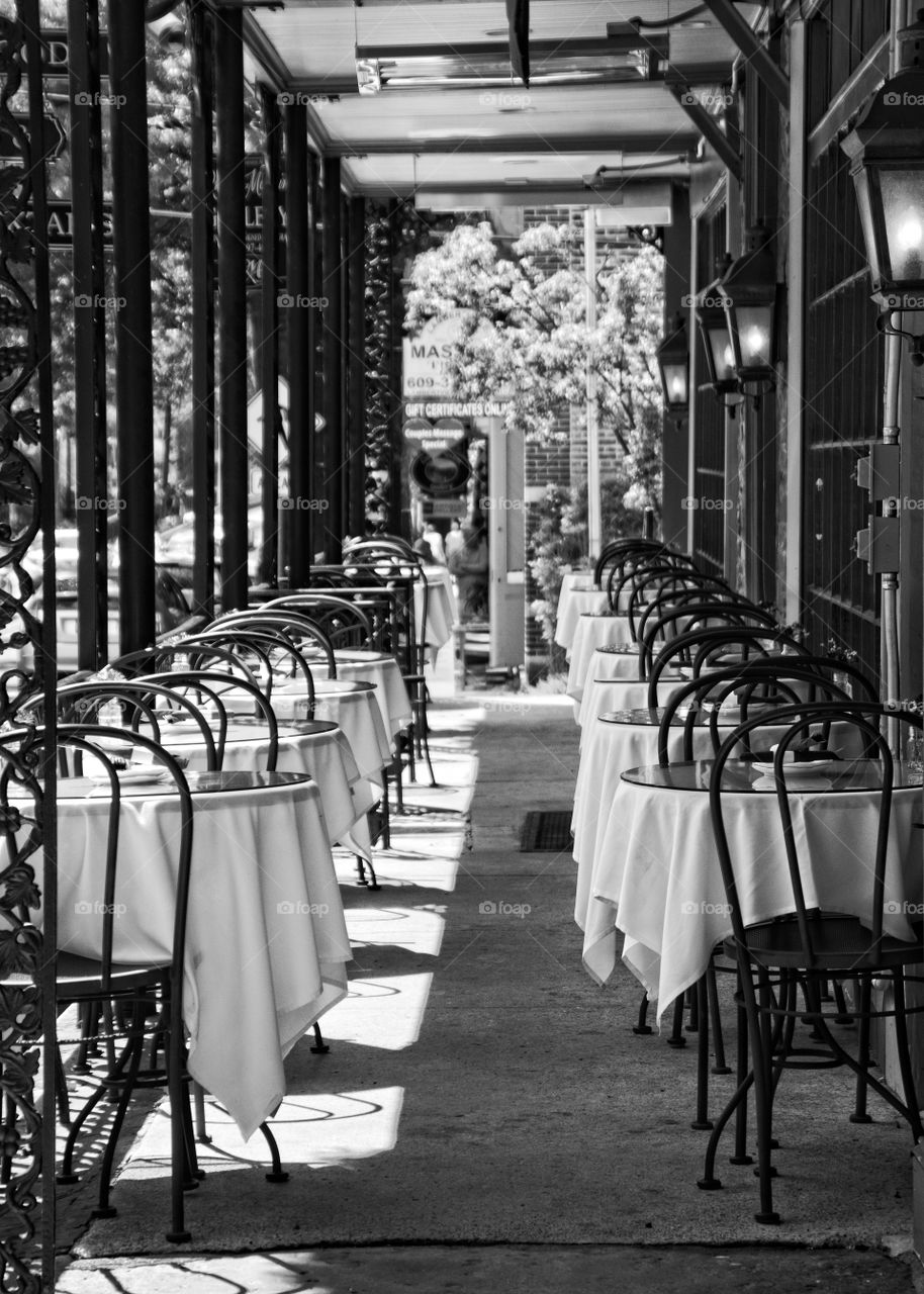 Outdoor restaurant  dining tables and chairs waiting for patrons in Lambertville, New Jersey