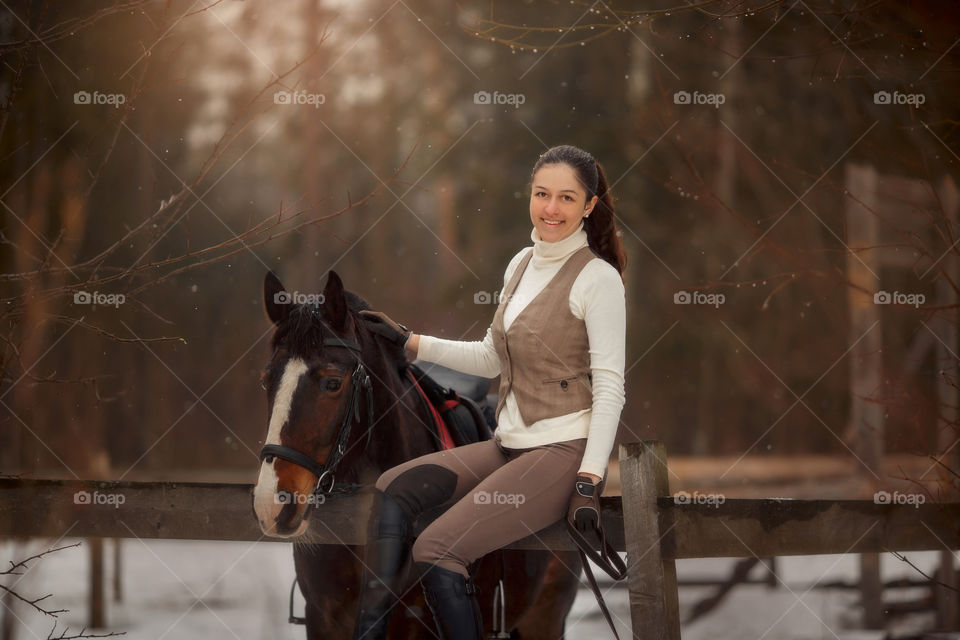 Young beautiful woman with horse outdoor portrait at spring day