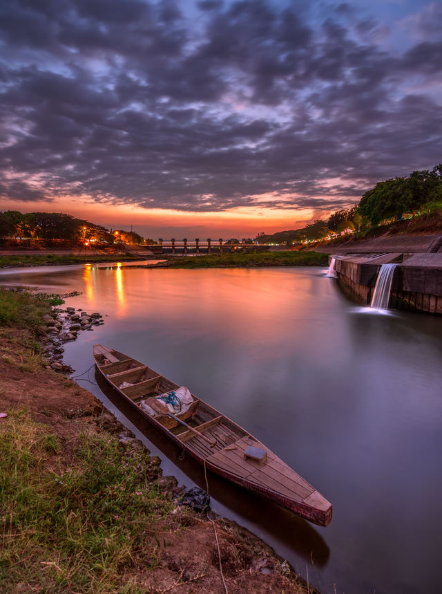 lonely boat during a cloudy sunset in rolak songo