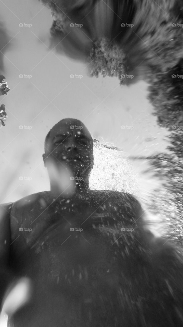 High angle view of reflected man on glass