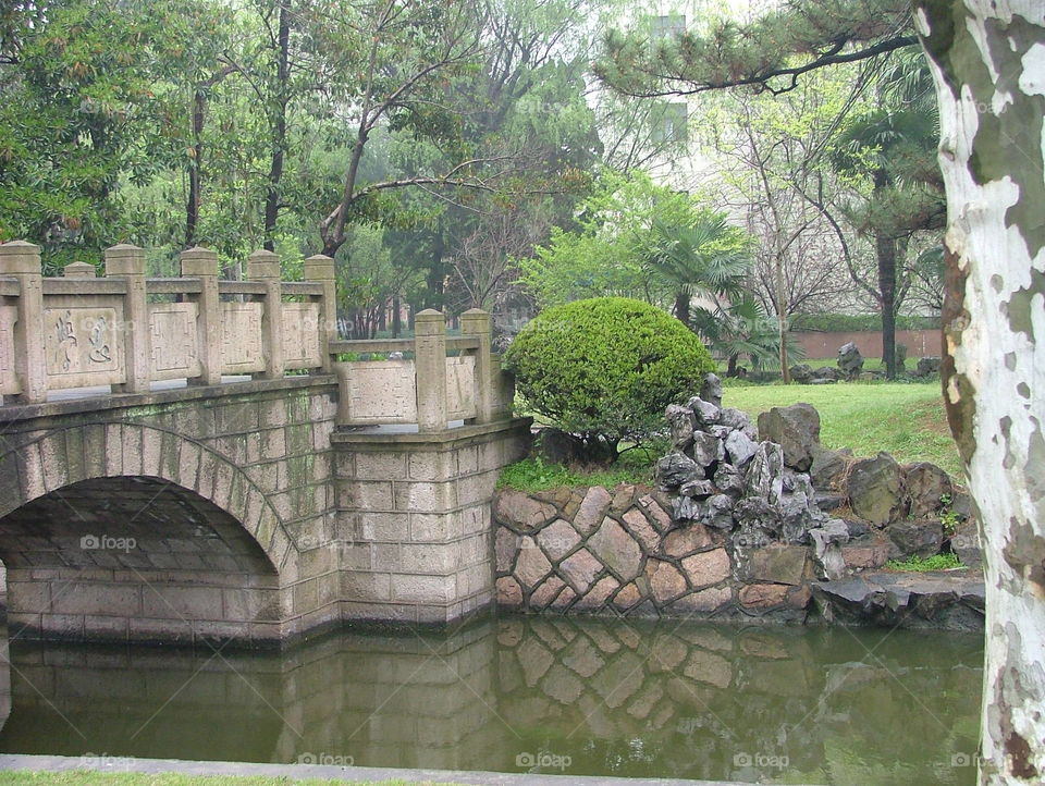 Chinese park. bridge and stones in Chinese park
