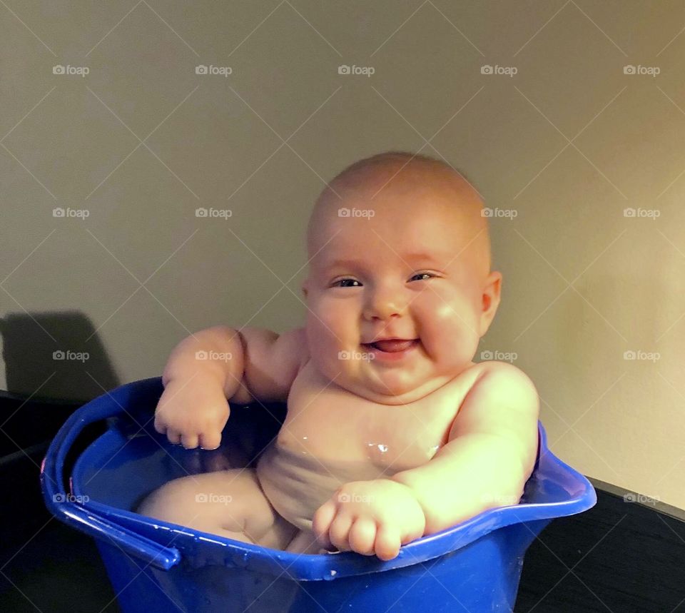 Nothing like a cool bucket bath on a hot afternoon to bring out the smiles and coos!