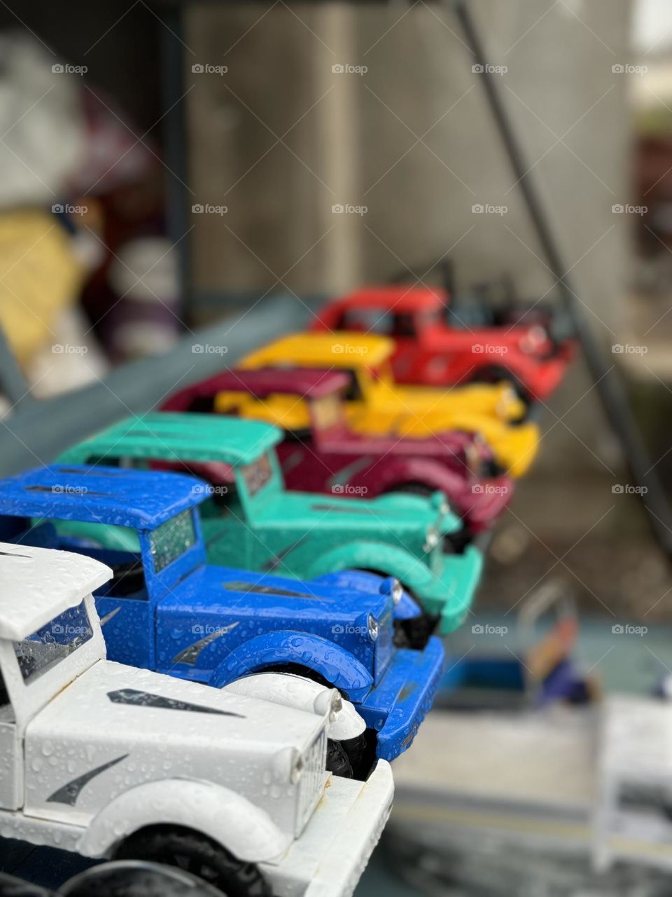 multicolored metal toy cars in raw