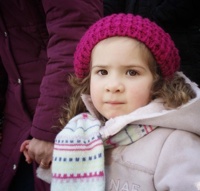 Little girl holding her grandmother's hand
