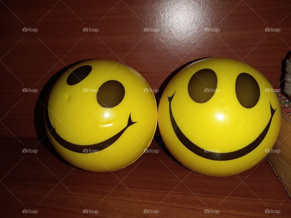 smiley balls on table