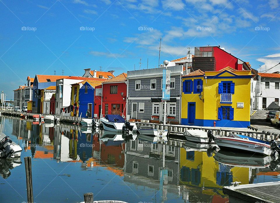 Multi colored houses near canal