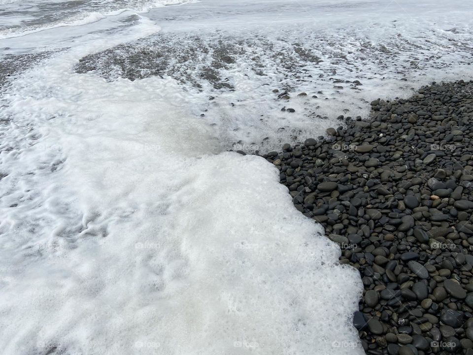 Sea foam at the ocean