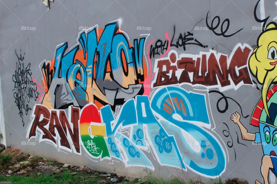 not many people know what it means, but street children make it more understandable with a scribble in a small town that has the name of the city written on it