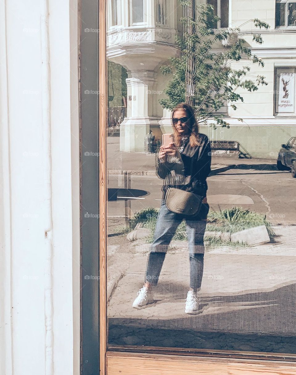 Reflection of a woman in a window 