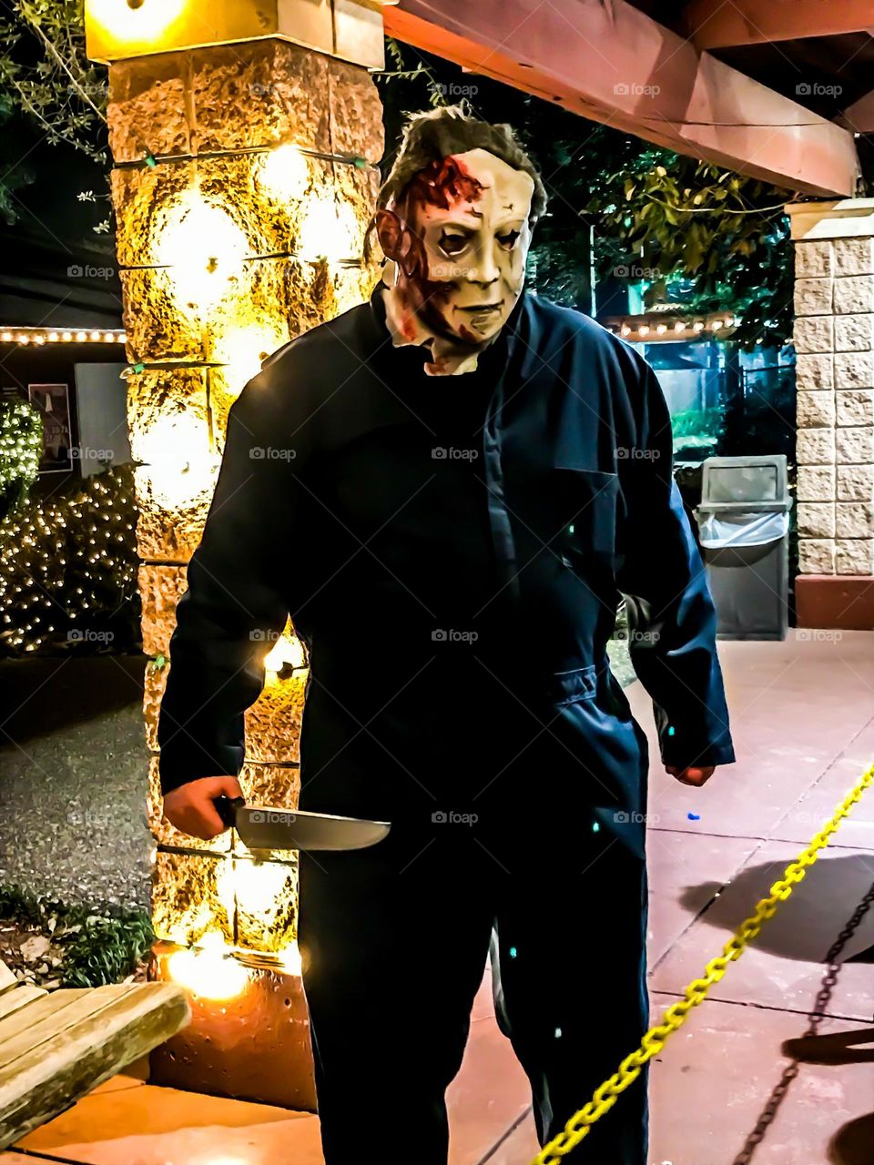 The classic Michael Myers costume among a Halloween celebration 