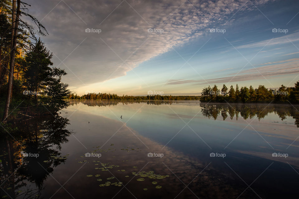 Lake. Sunrise time. Mirror. Reflections.