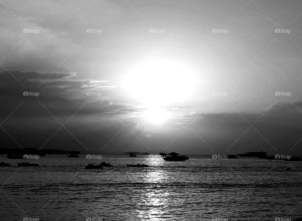 Sunset above the sea in black and white