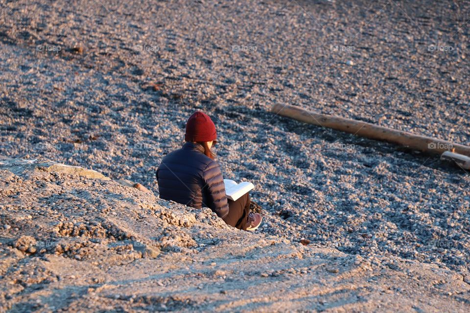 Woman reading on a beach