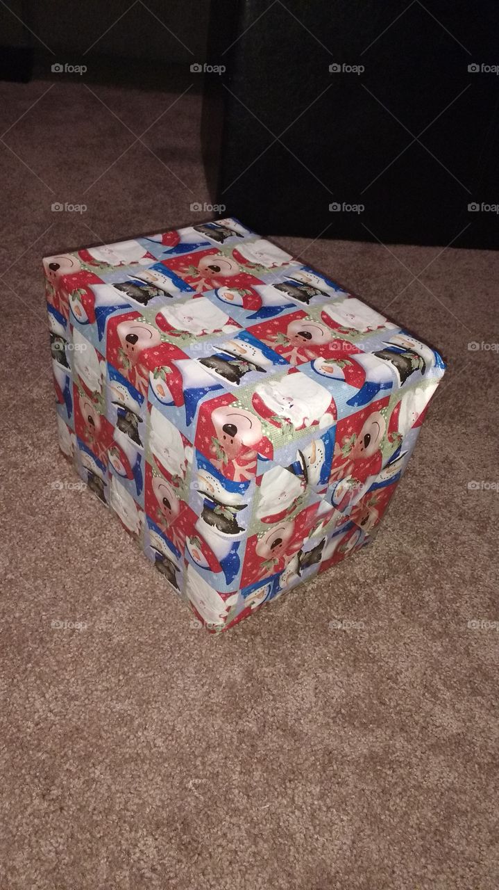 birthday present wrapped in Christmas paper