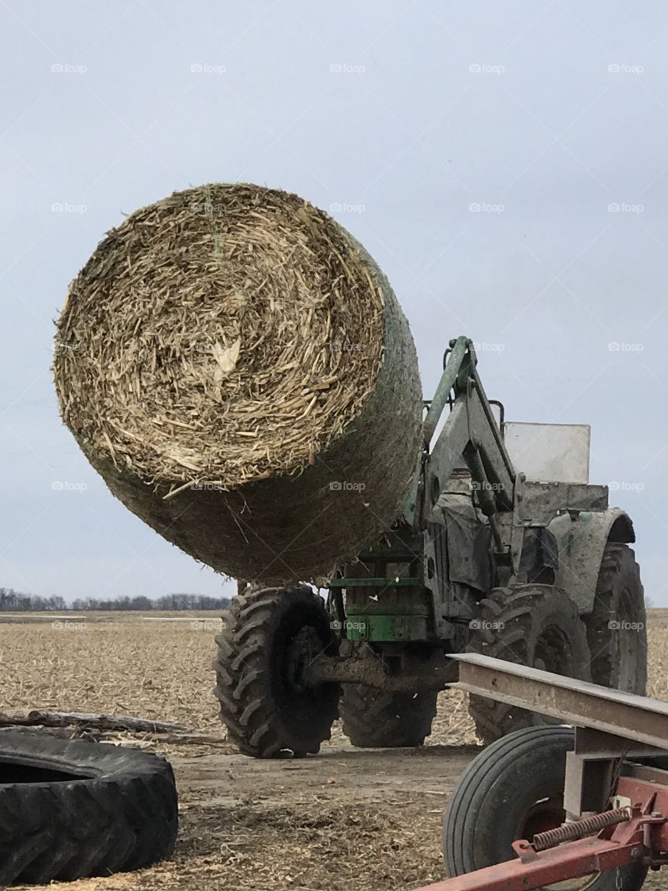 Round Bale. John Deere loader. Farming. Hay.