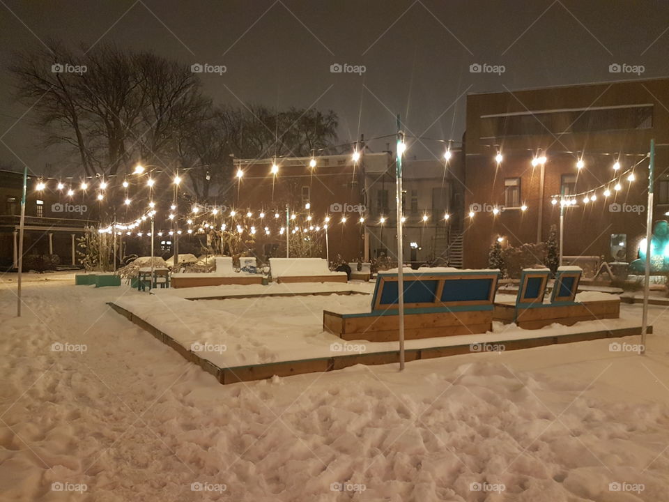 First snow on a little square in Montréal. Québec. Canada.