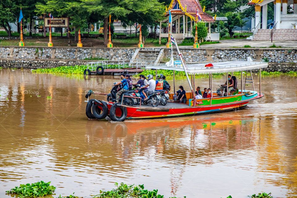 Thai People cross the Chaophraya River with a ferry boat in Ayutthaya Thailand Southeast Asia