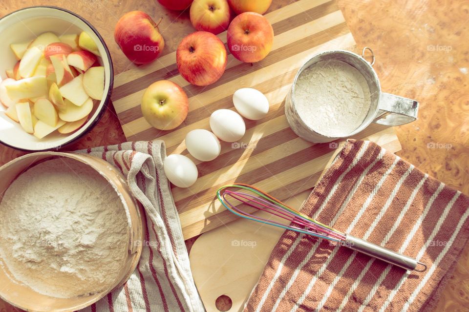 Making homemade puffed apple pie with eggs, sugar and flour.