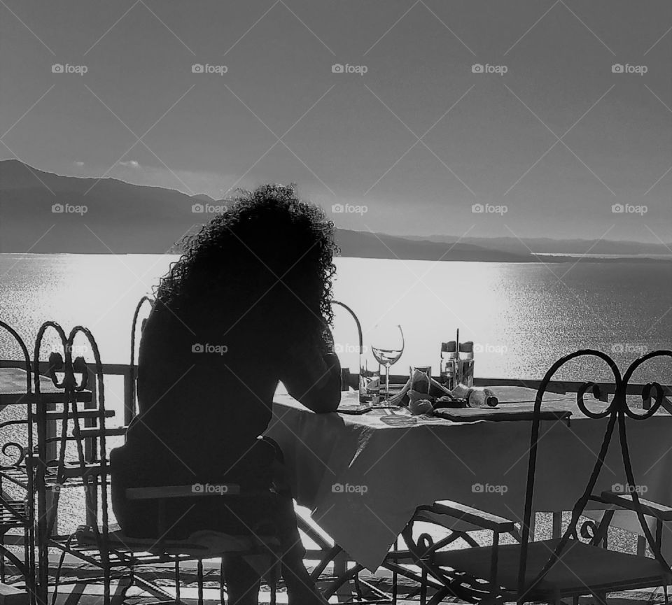 Lady at lunch on the Ionian Sea