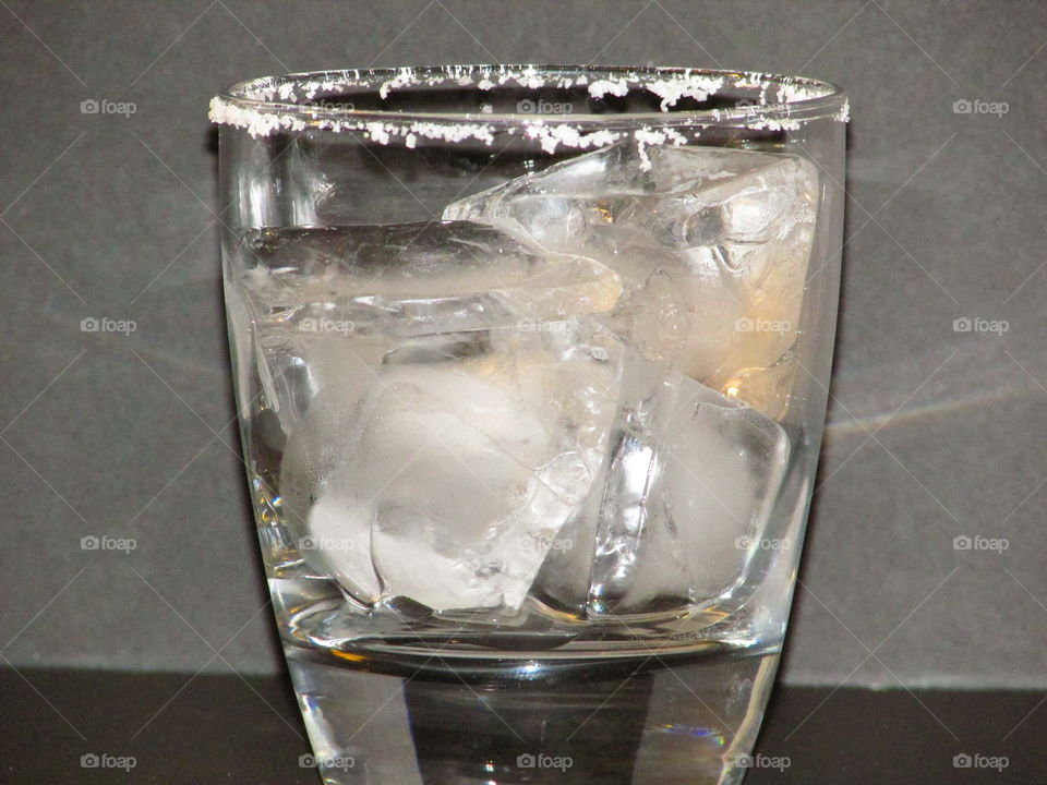 clear glass with ice waiting for tequila